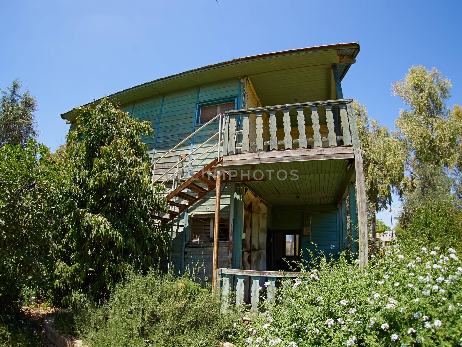 Old weathered abandoned western colonial style wooden house shed