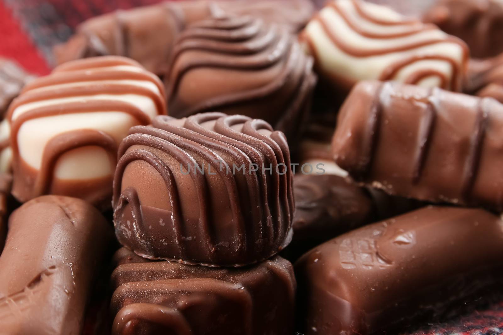 An assortment of fine chocolates in white, dark, and milk chocolate