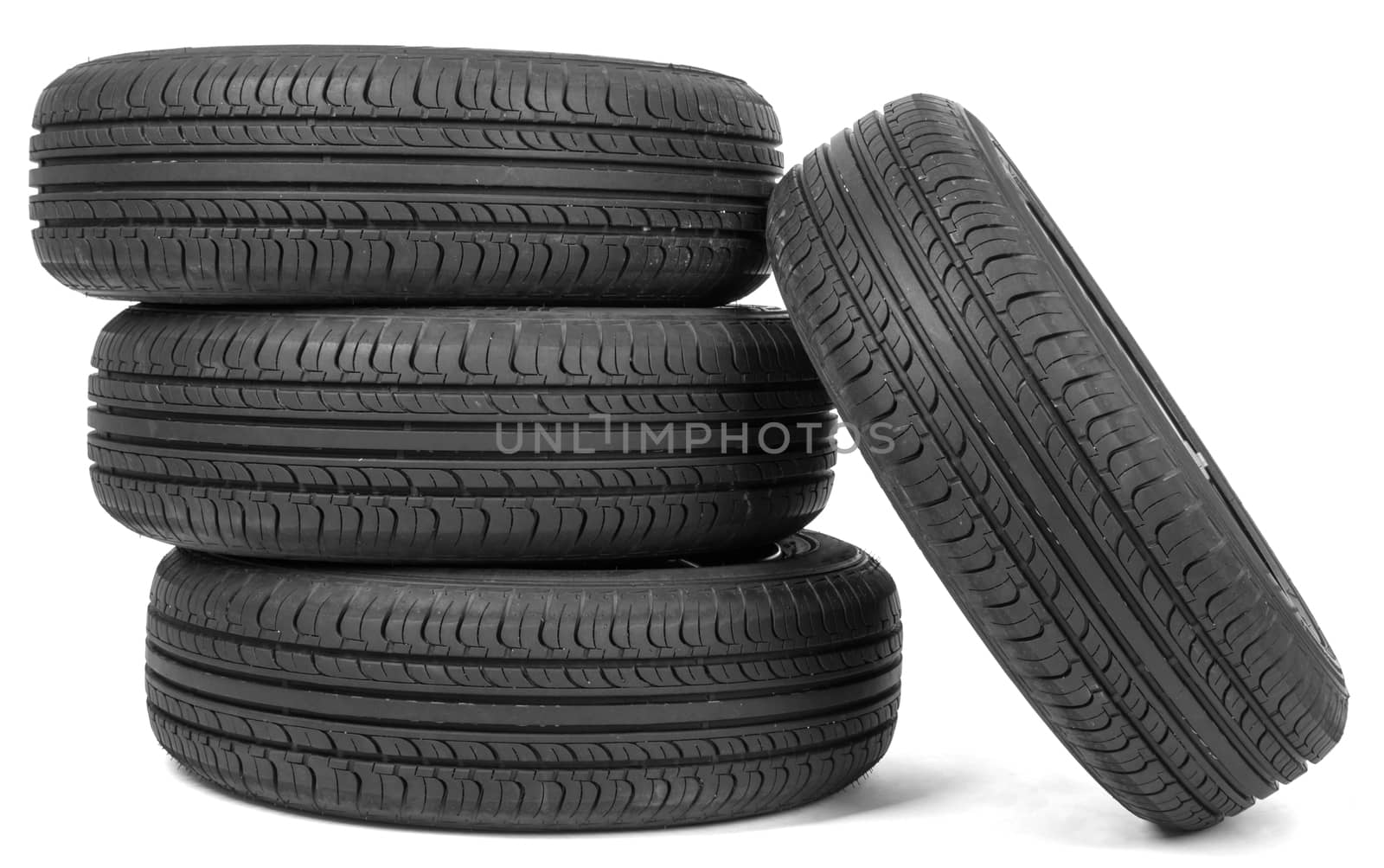 Stack of four wheel new black tyres by cherezoff