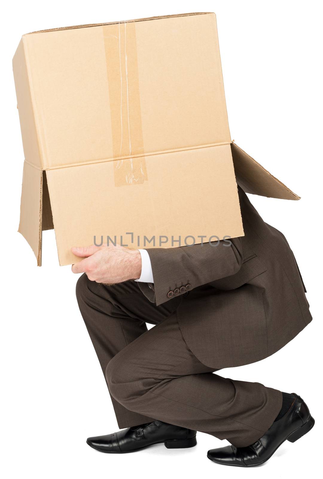 Businessman running with brown box on his head, isolated on white background