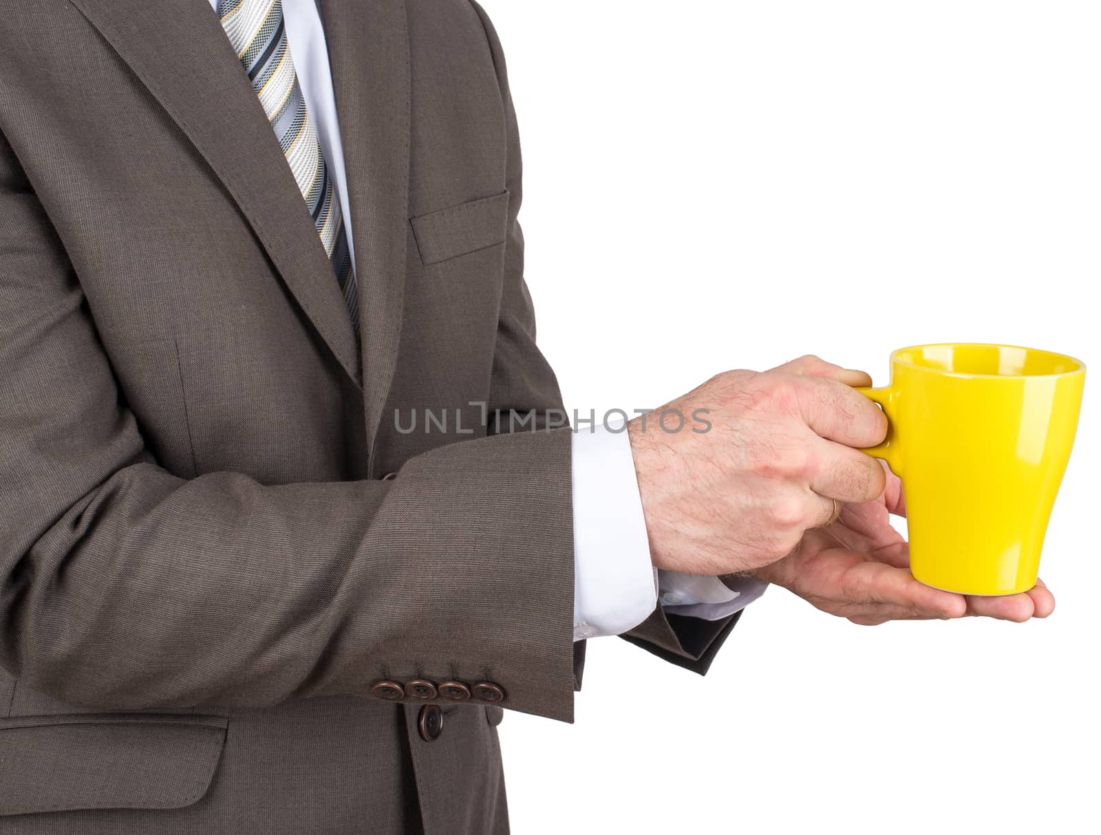 Business man holding yellow cup of black coffee by cherezoff