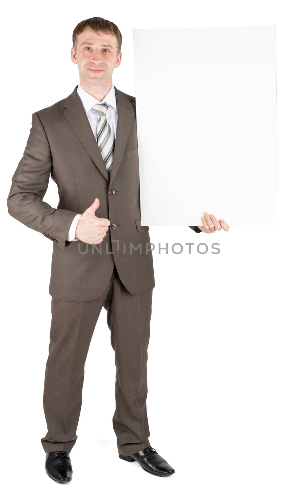 Happy businessman holding blank paper by cherezoff