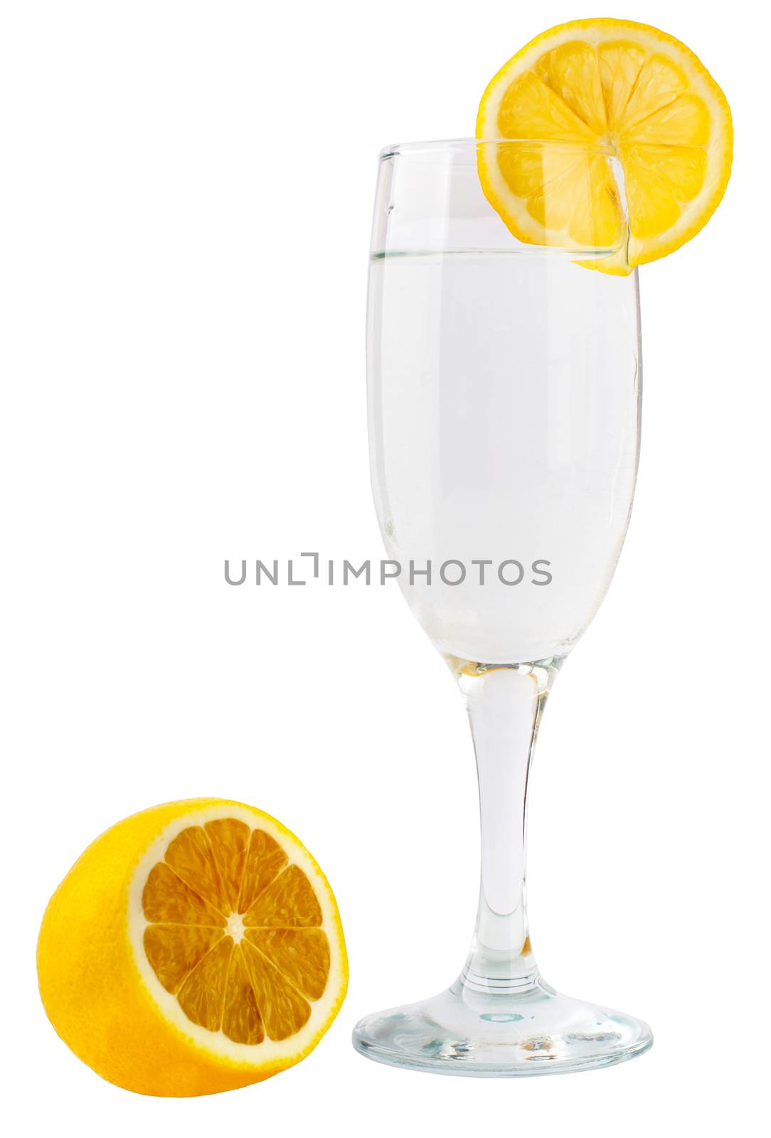 Glass of champagne with lemon slice by cherezoff