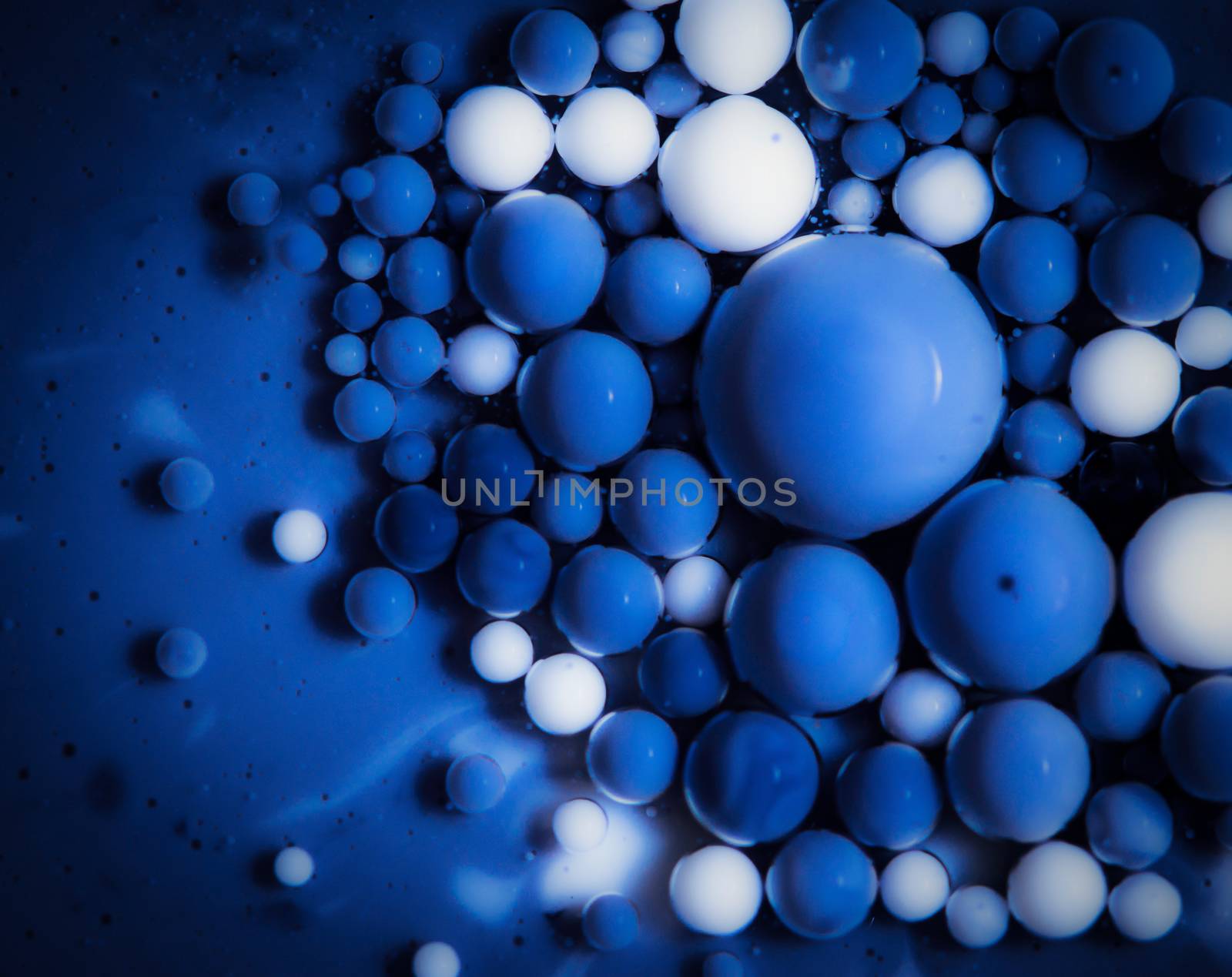 abstract background colored balls blue drops in oil