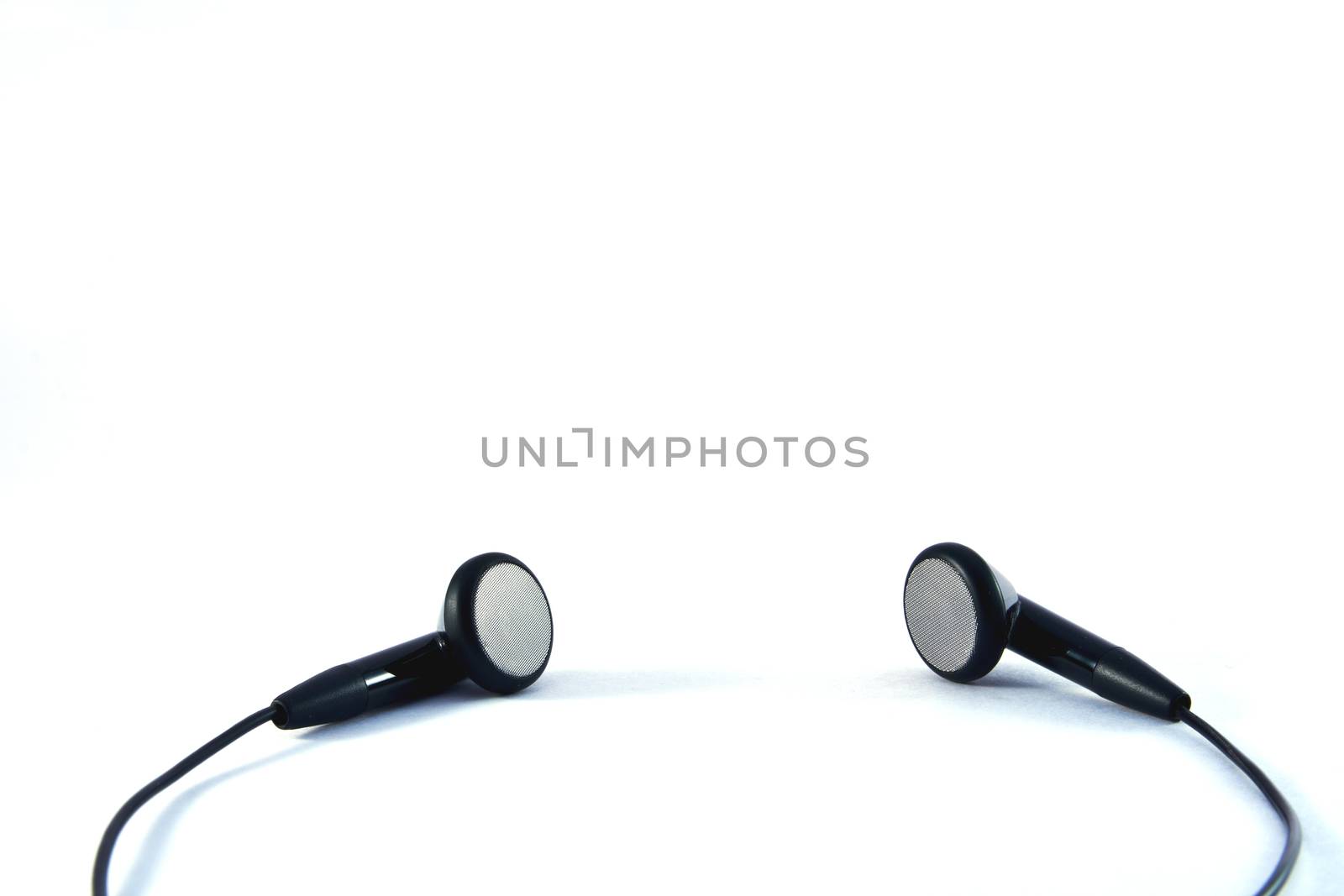 Black headphones with wires on white background 