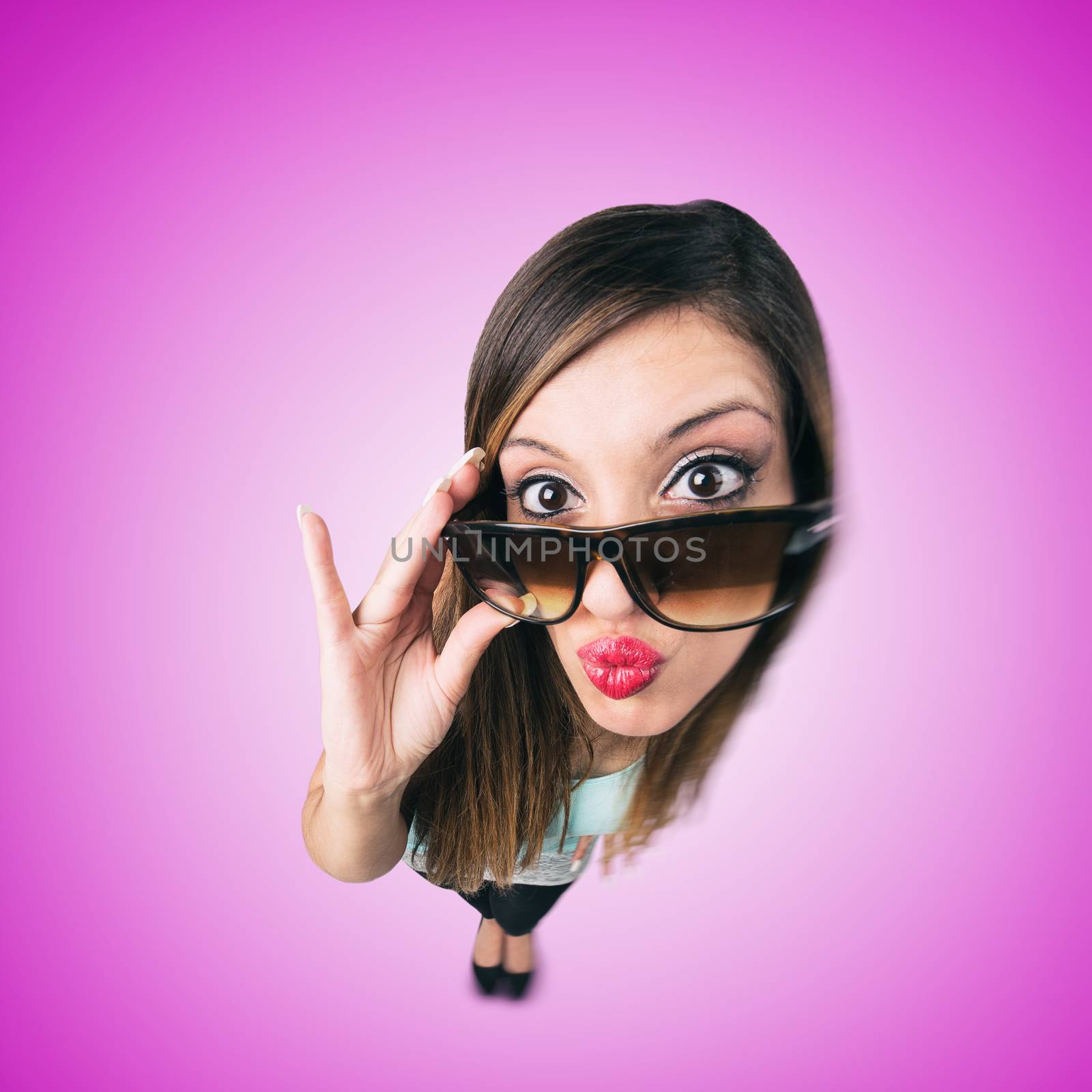 Funny Kissing Girl with Sunglasses looks like caricature of herself, fish eye lens shot

