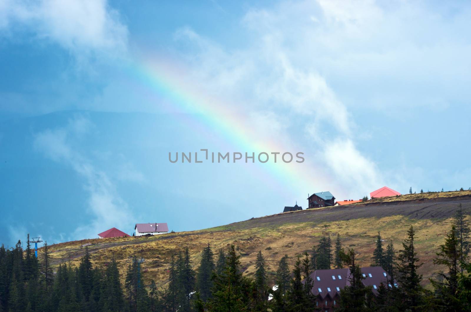 Mountain landscape with a rainbow by dolnikow