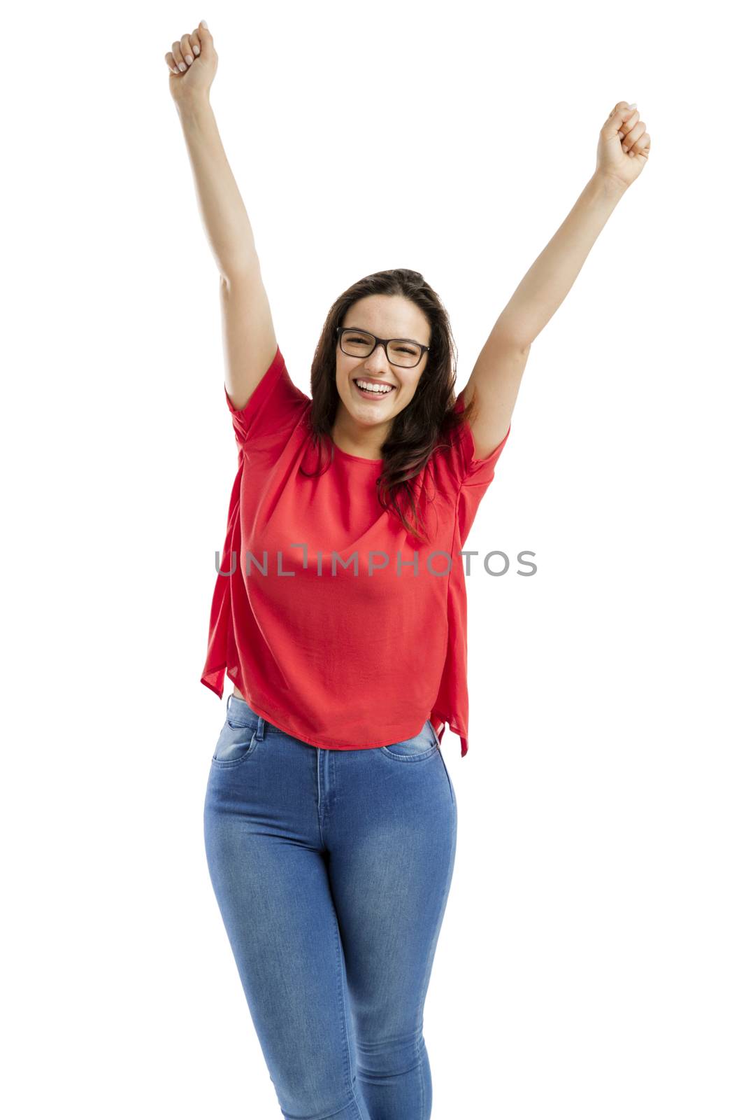 Happy woman with arms up, isolated over white background