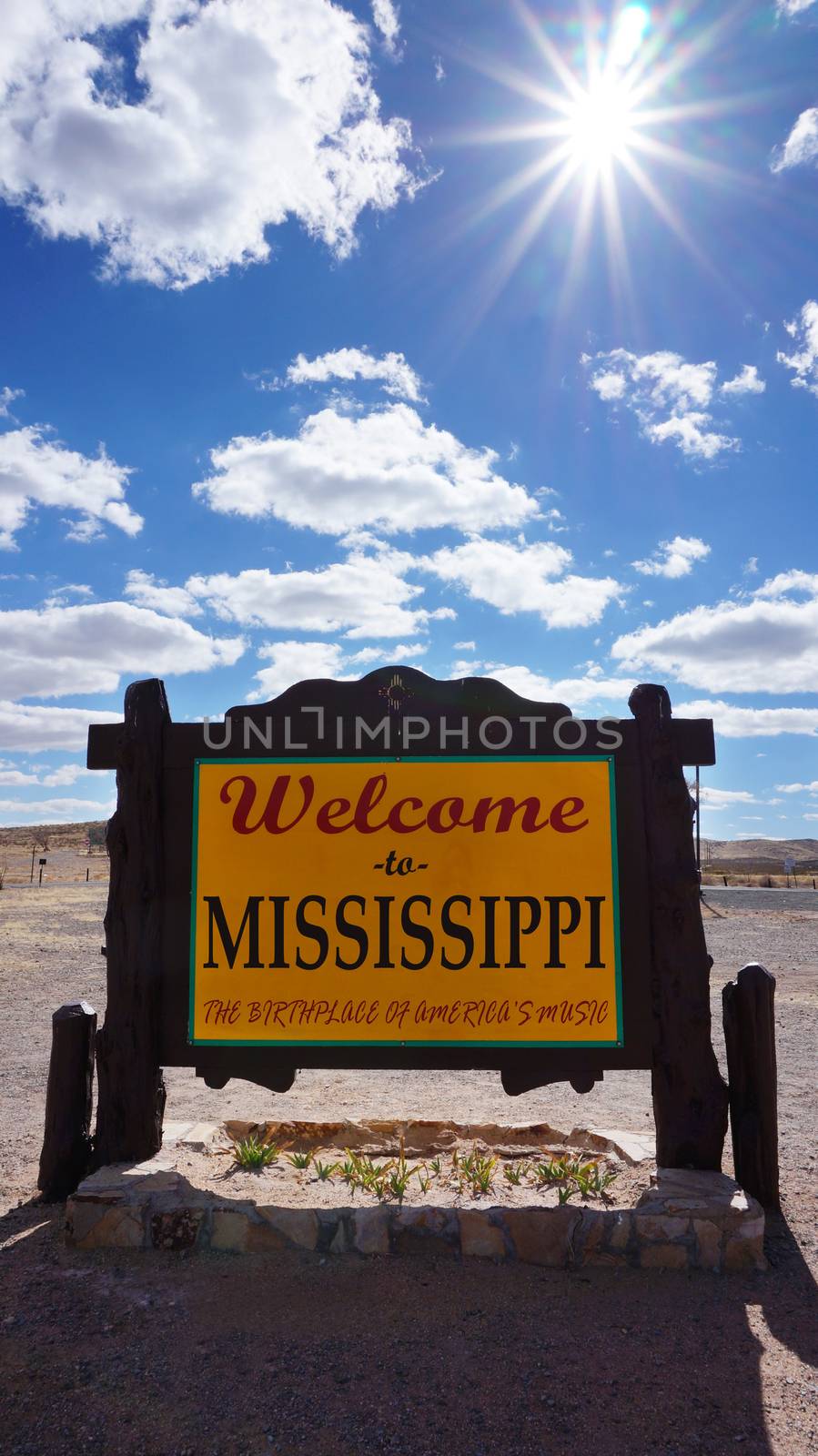 Welcome to Mississippi road sign with blue sky