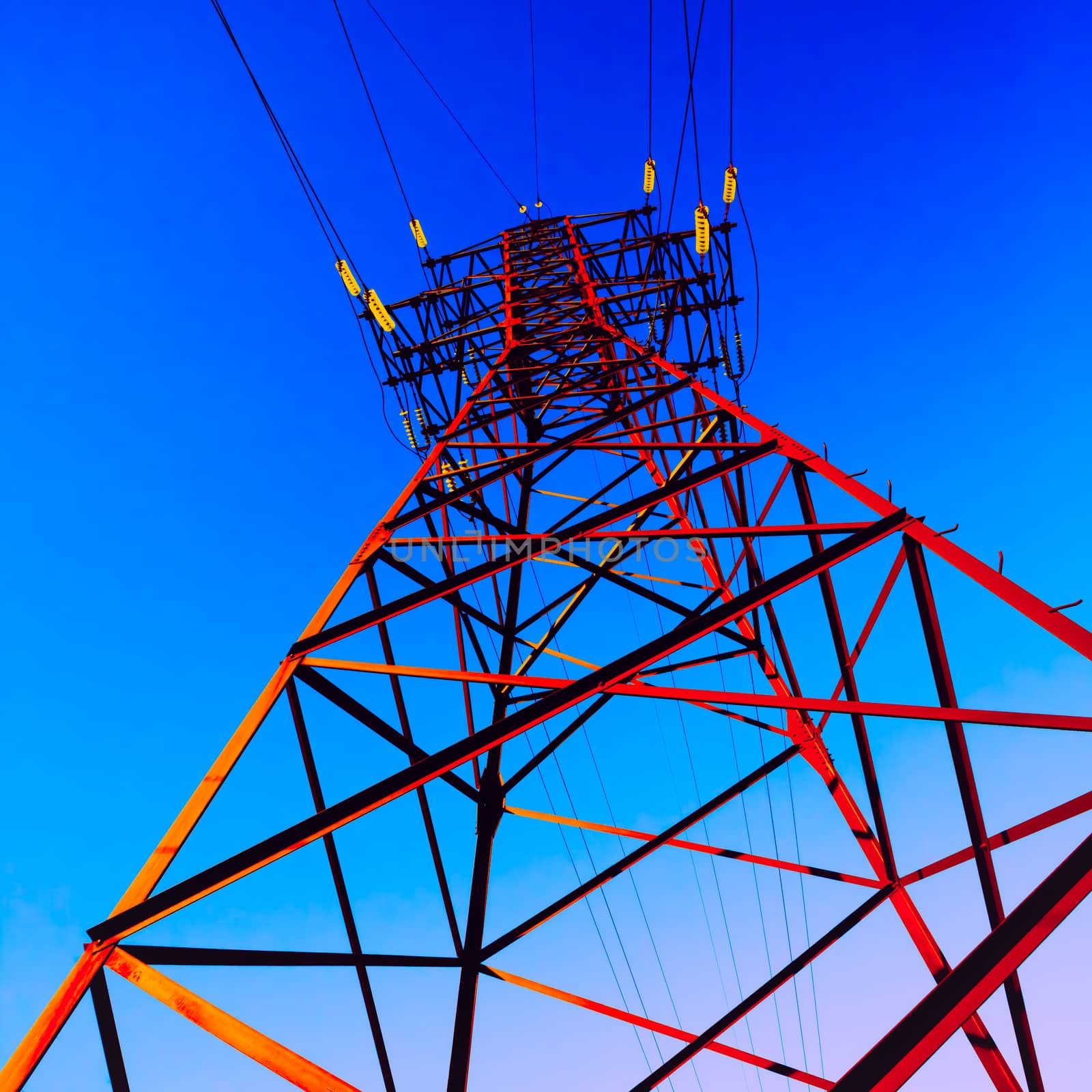 High voltage post. High-voltage tower sky background.