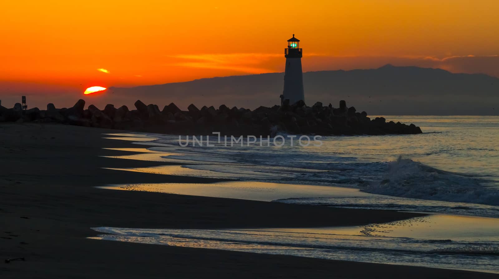 Lighthouse on Santa Cruz Shore by hanusst