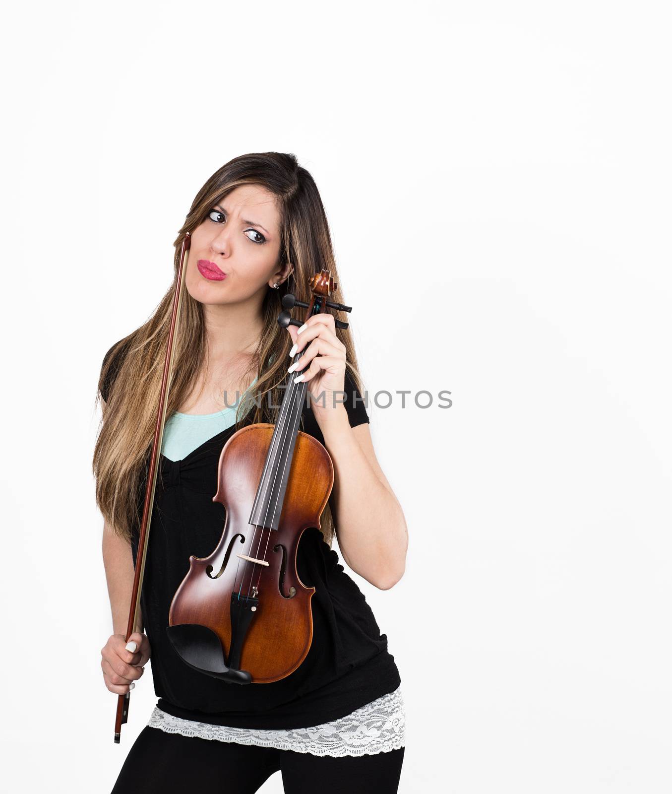 Beautiful puzzled student girl with her violin