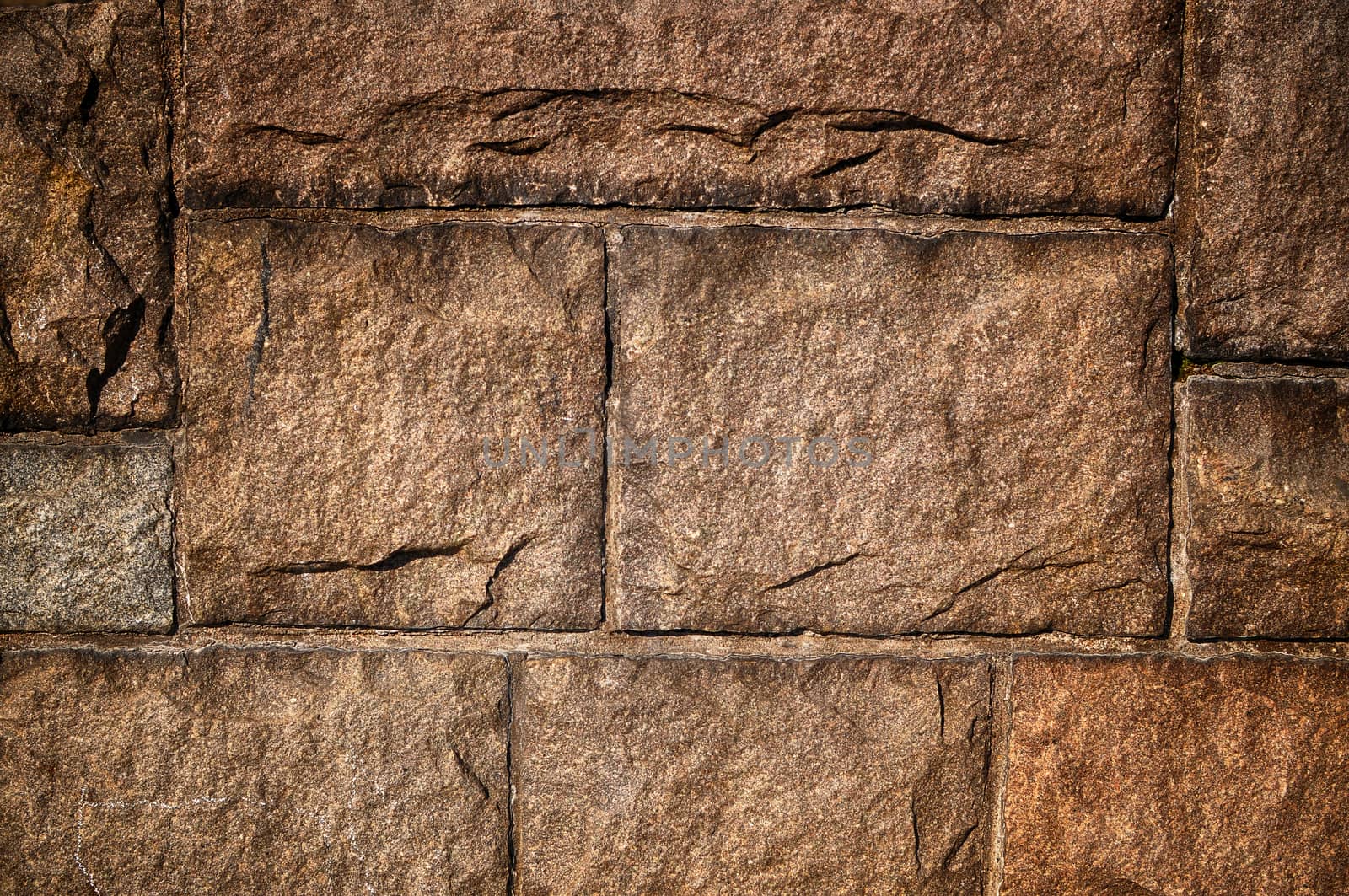 Ancient stonewall in closeup as background.