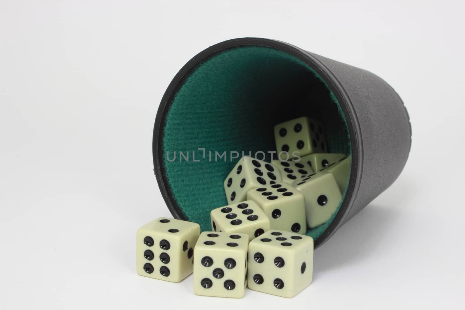 White dice with black and green dice cup - isolated by HoleInTheBox