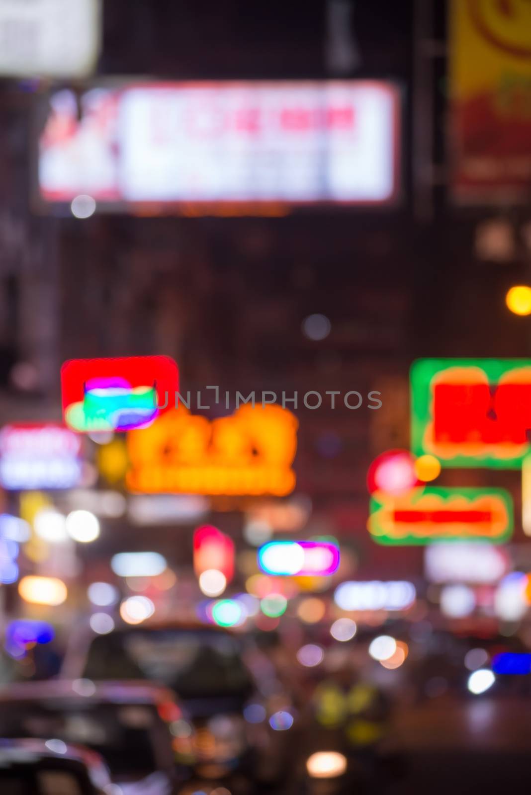 blurred image of people moving in night city  Jordan neighborhood street. Art toning abstract urban background. Hong Kong