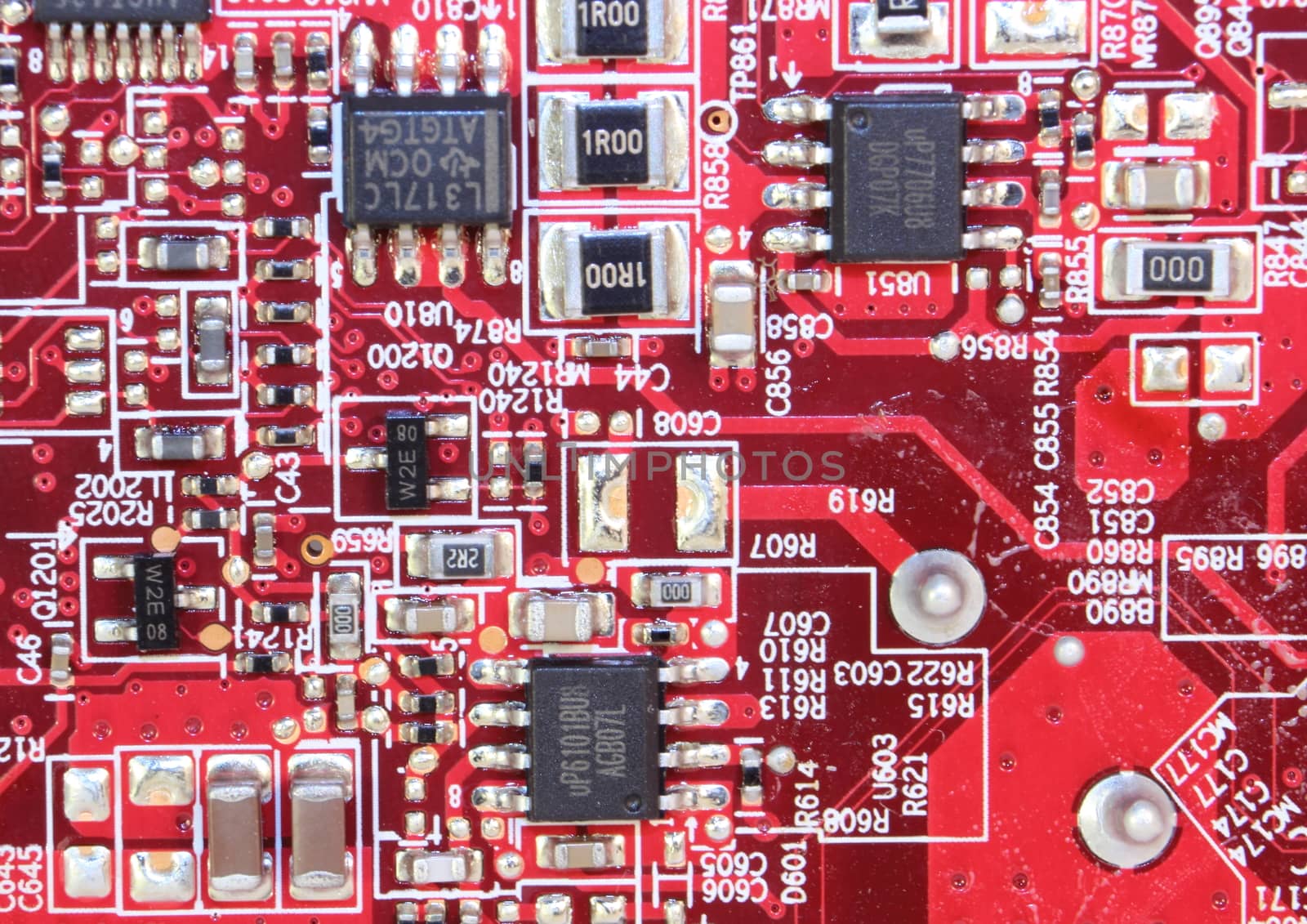 Red printed electronic circuit board with small mounted device by HoleInTheBox
