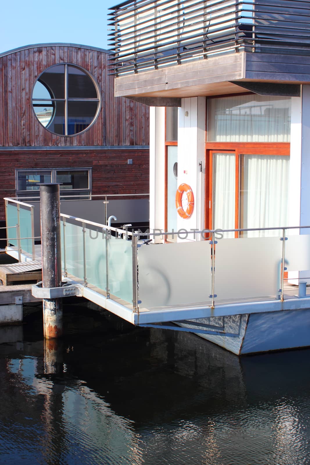Houseboat with orange lifesaver at the porch by HoleInTheBox