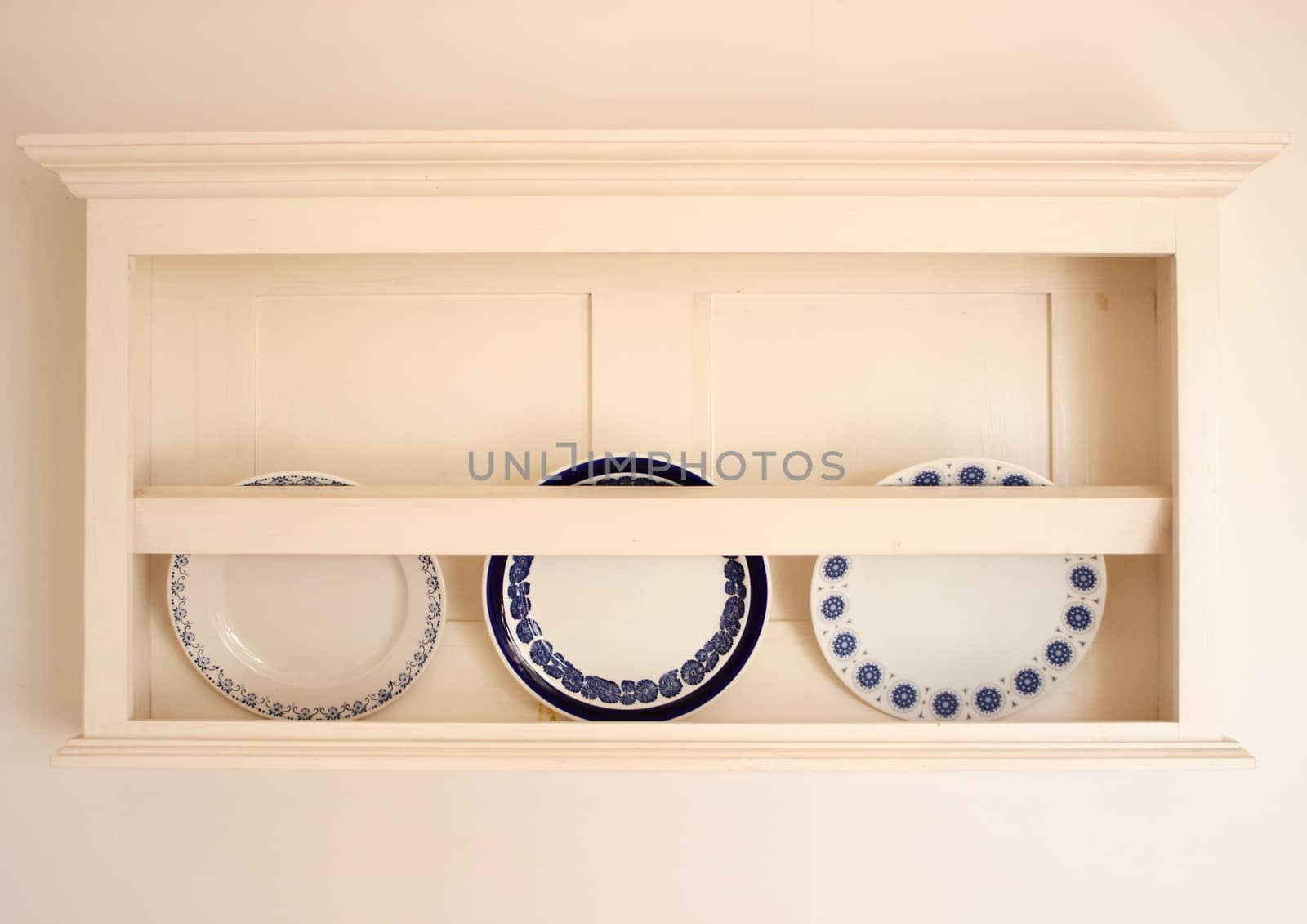 Old plateholder with three plates in summerhouse in Denmark by HoleInTheBox