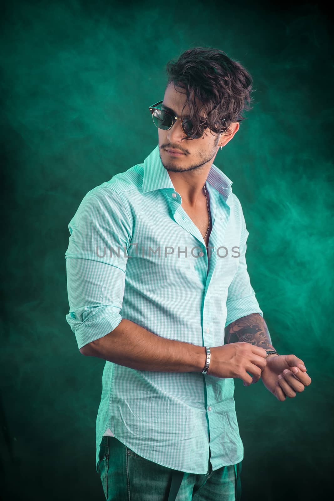Stylish handsome young man in studio shot by artofphoto