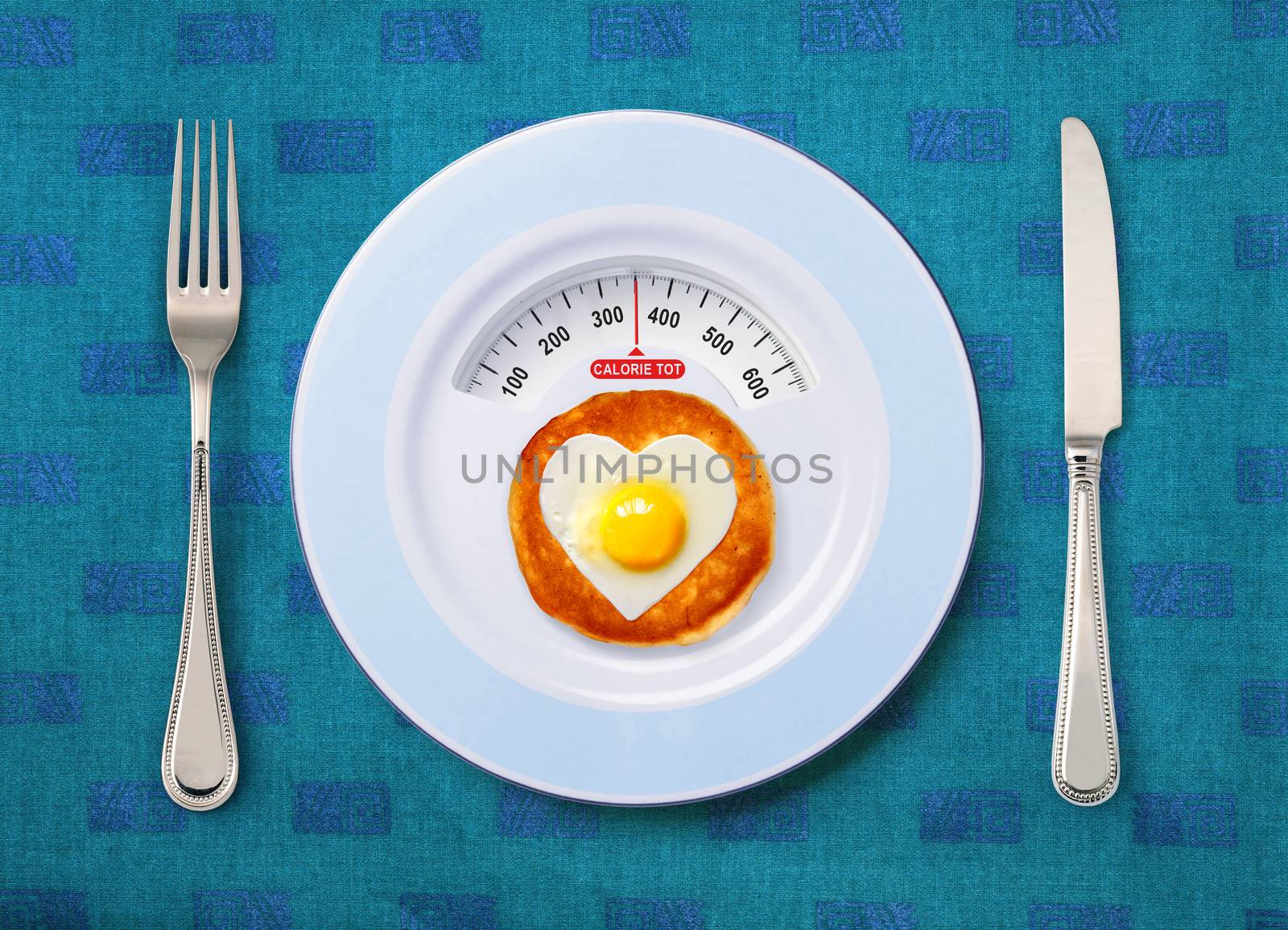 view of calorie tot in fried egg that on white plate