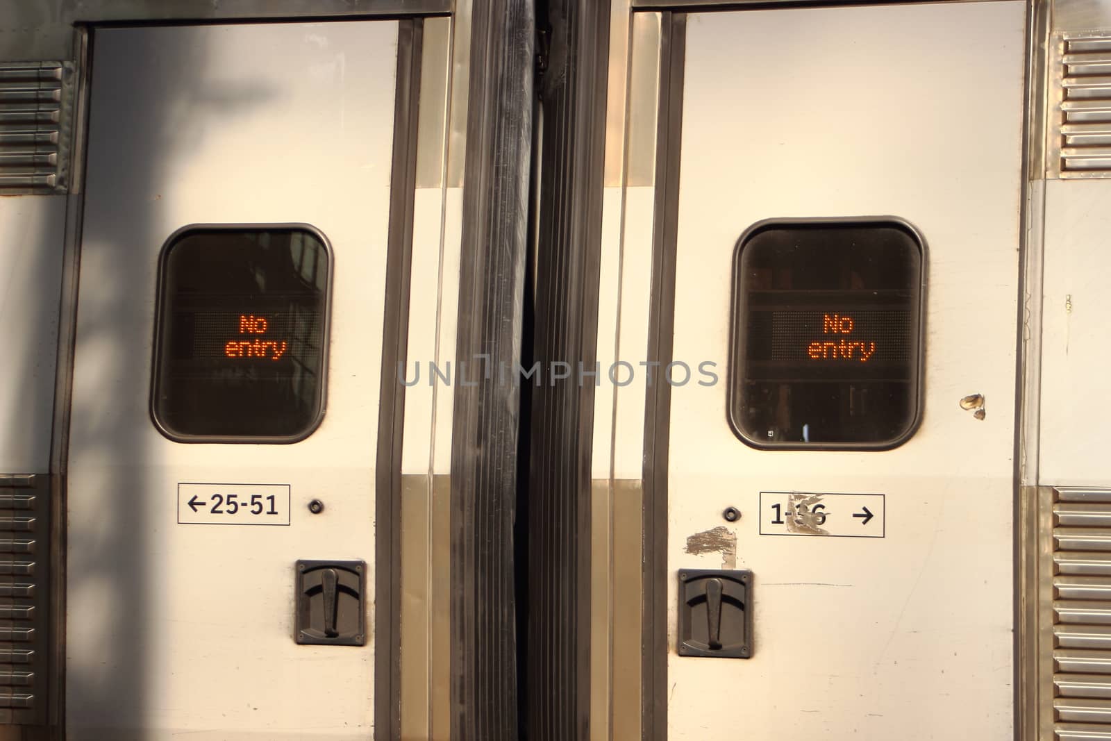 Closed sliding train doors with No Entry sign