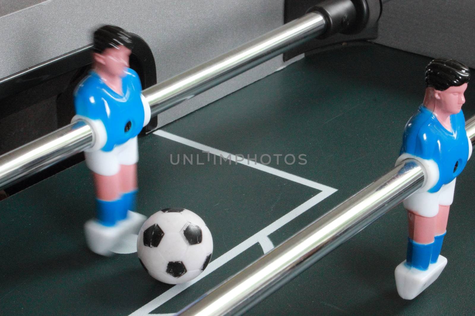 Football table game with blue goal keeper