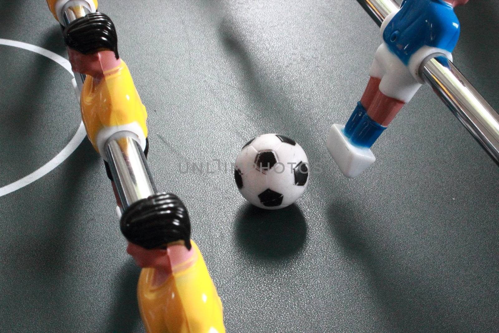 Football table game with ball in action