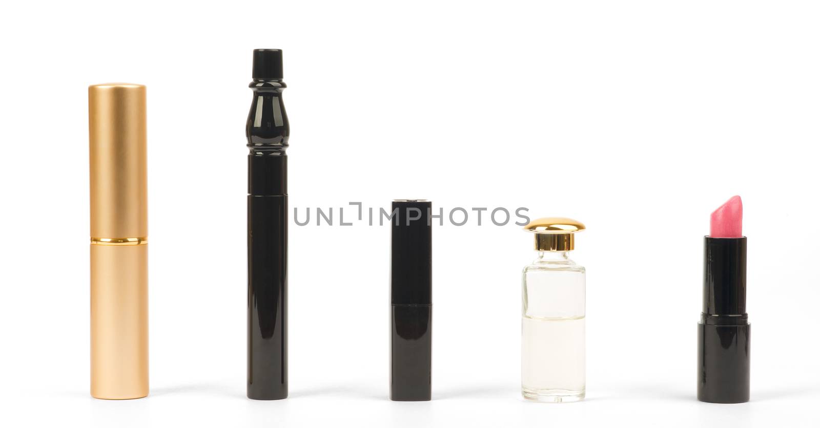Various cosmetics with perfume on isolated white background