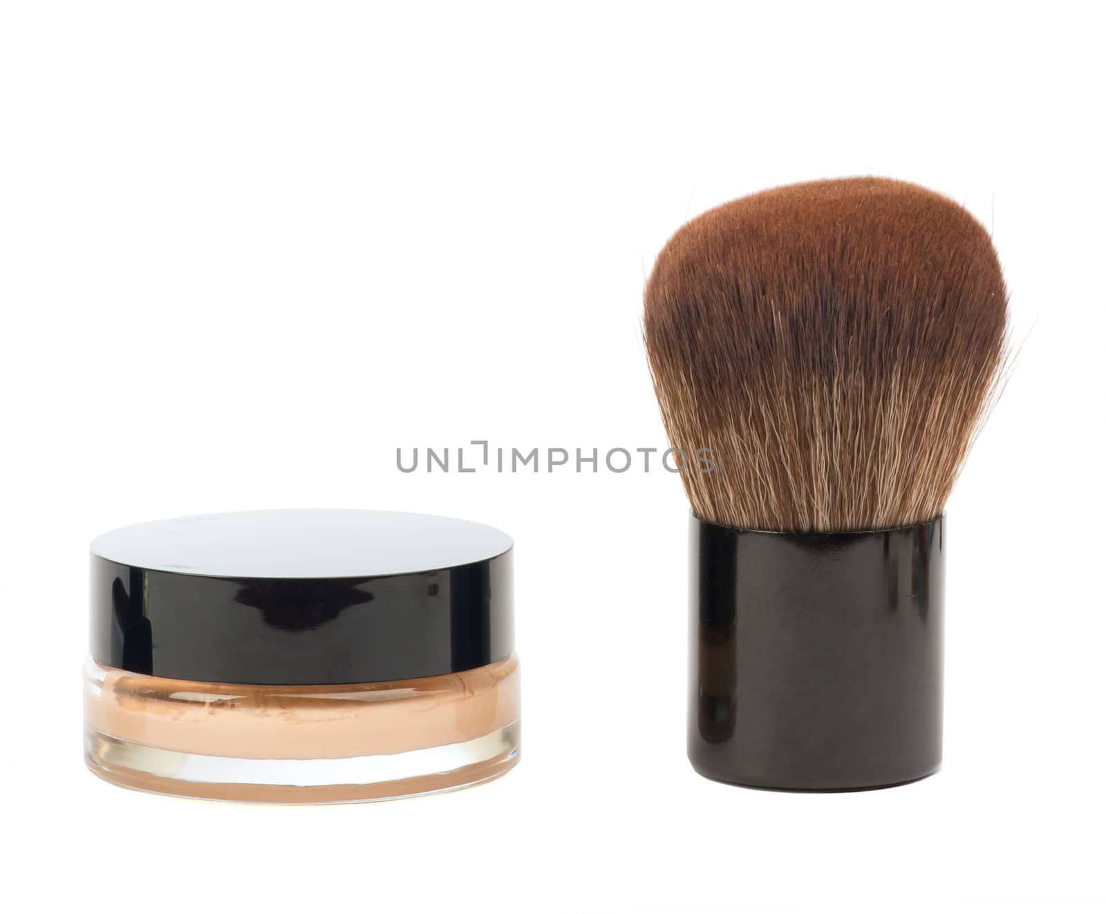 Cosmetic liquid foundation and brush isolated on white. Cosmetics