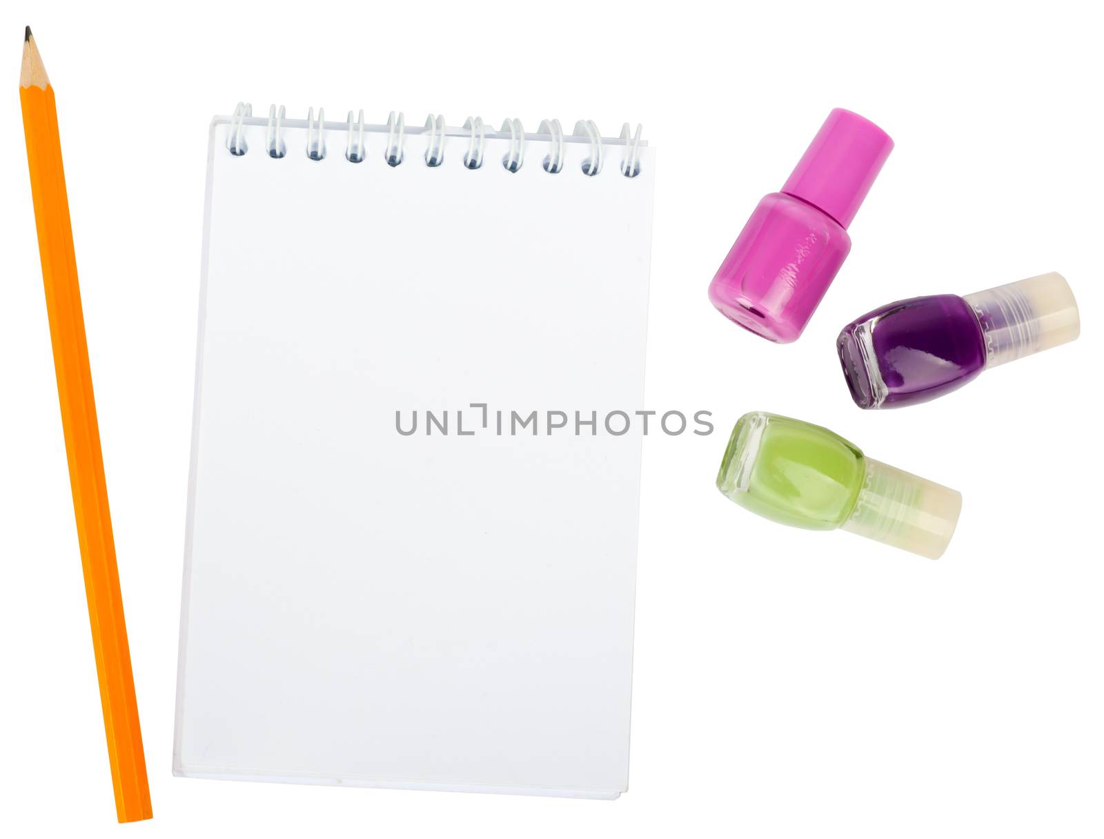 Open copybook with nail polishes on isolated white background