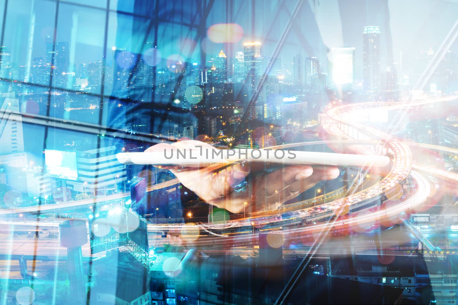 Double Exposure of BusinessMan hold Digital Tablet with Modern C by thampapon