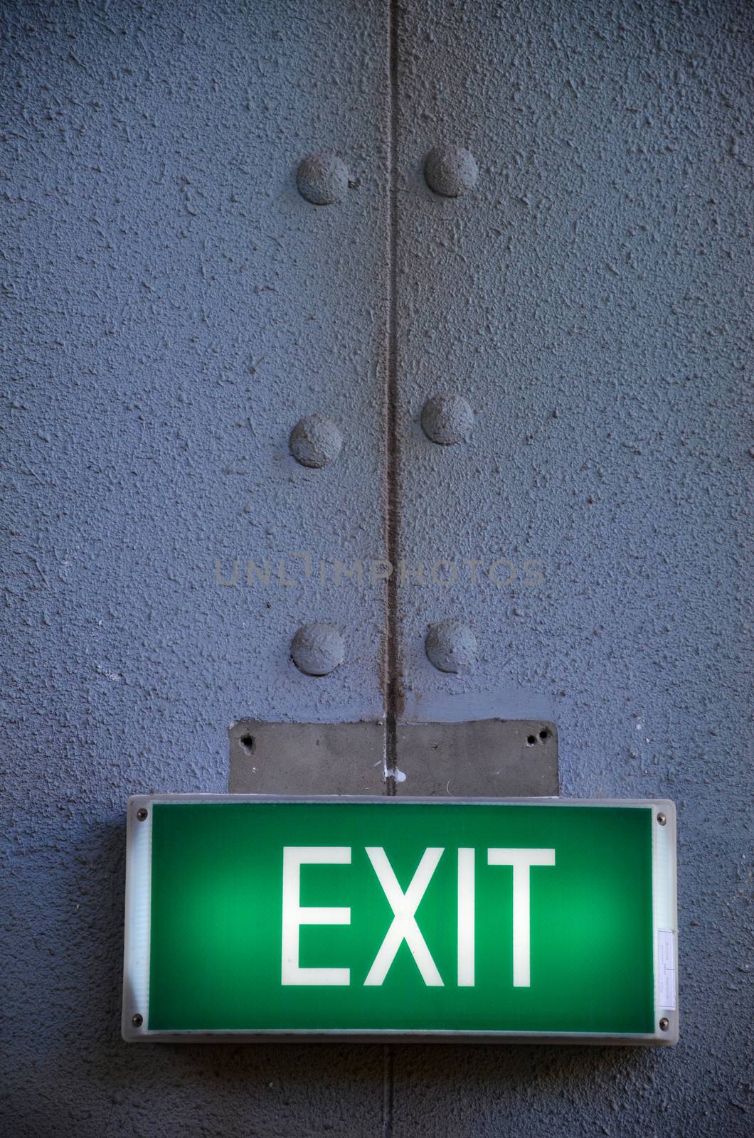 Exit sign points the way out by tang90246