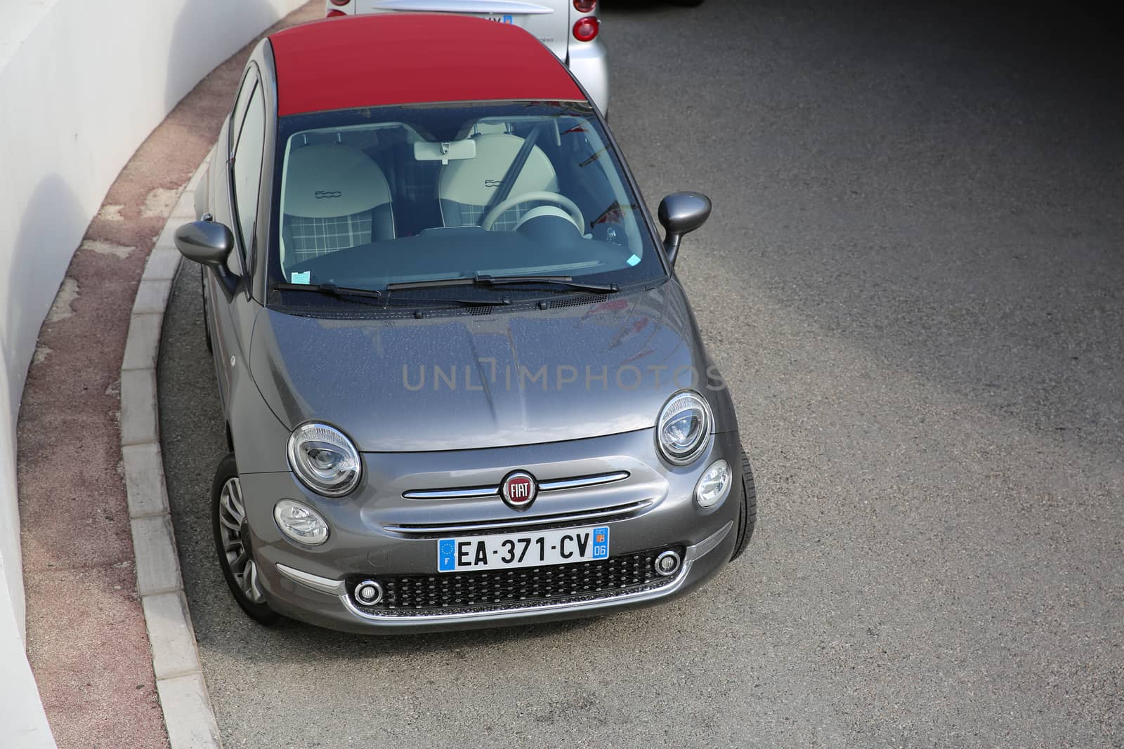 Monte-Carlo, Monaco - May 17, 2016:  Fiat 500 Convertible Car Parked in Front of the Fairmont Monte Carlo Hotel in Monaco