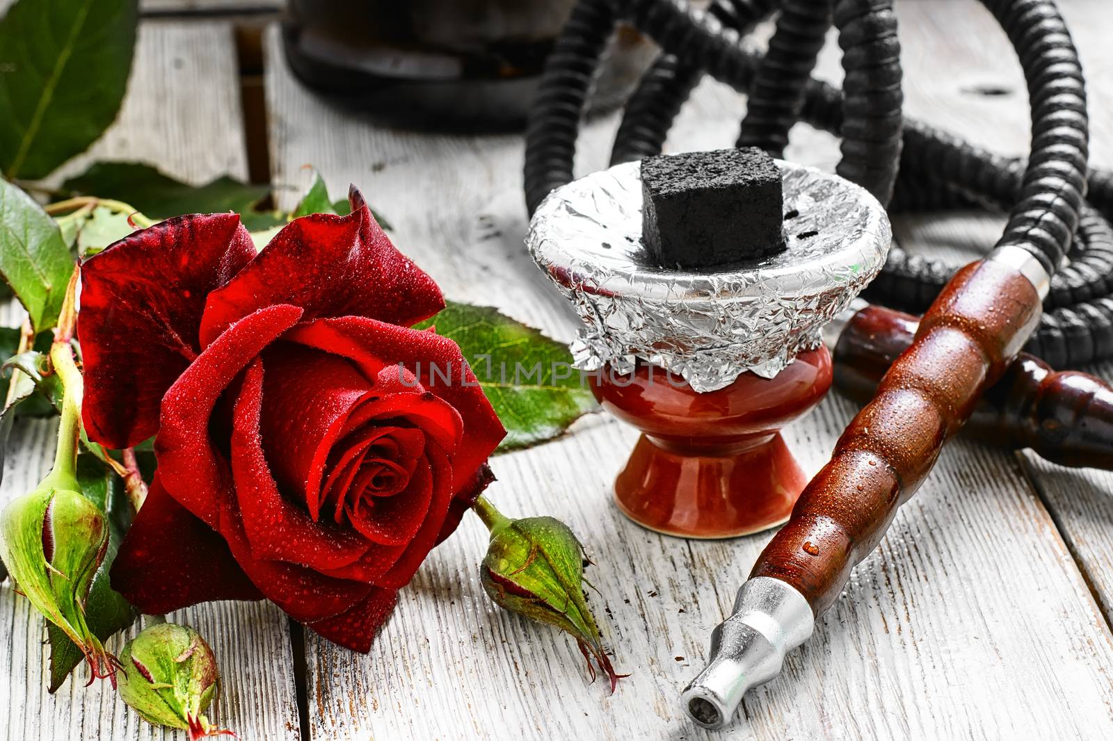 Smoking Turkish hookah filled with tobacco with the taste of roses