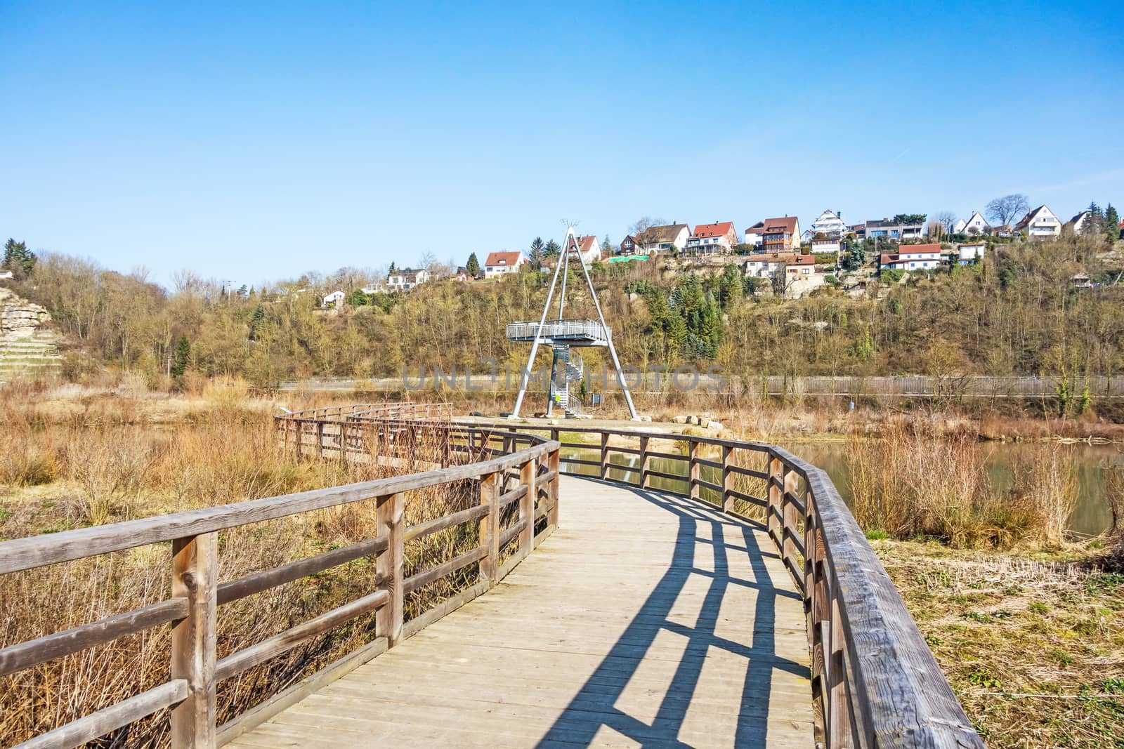 Poppwenweiler, Germany - February 27, 2016: Natural reserve "Zugwiesen" tower with pier near Poppenweiler, Ludwigsburg, Germany