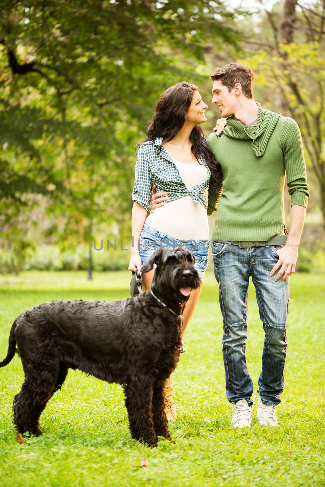 Young Couple With Giant Schnauzer by MilanMarkovic78
