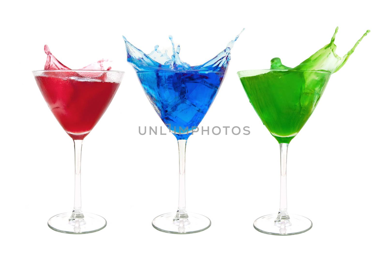 Three different cocktails with a splash over a white background