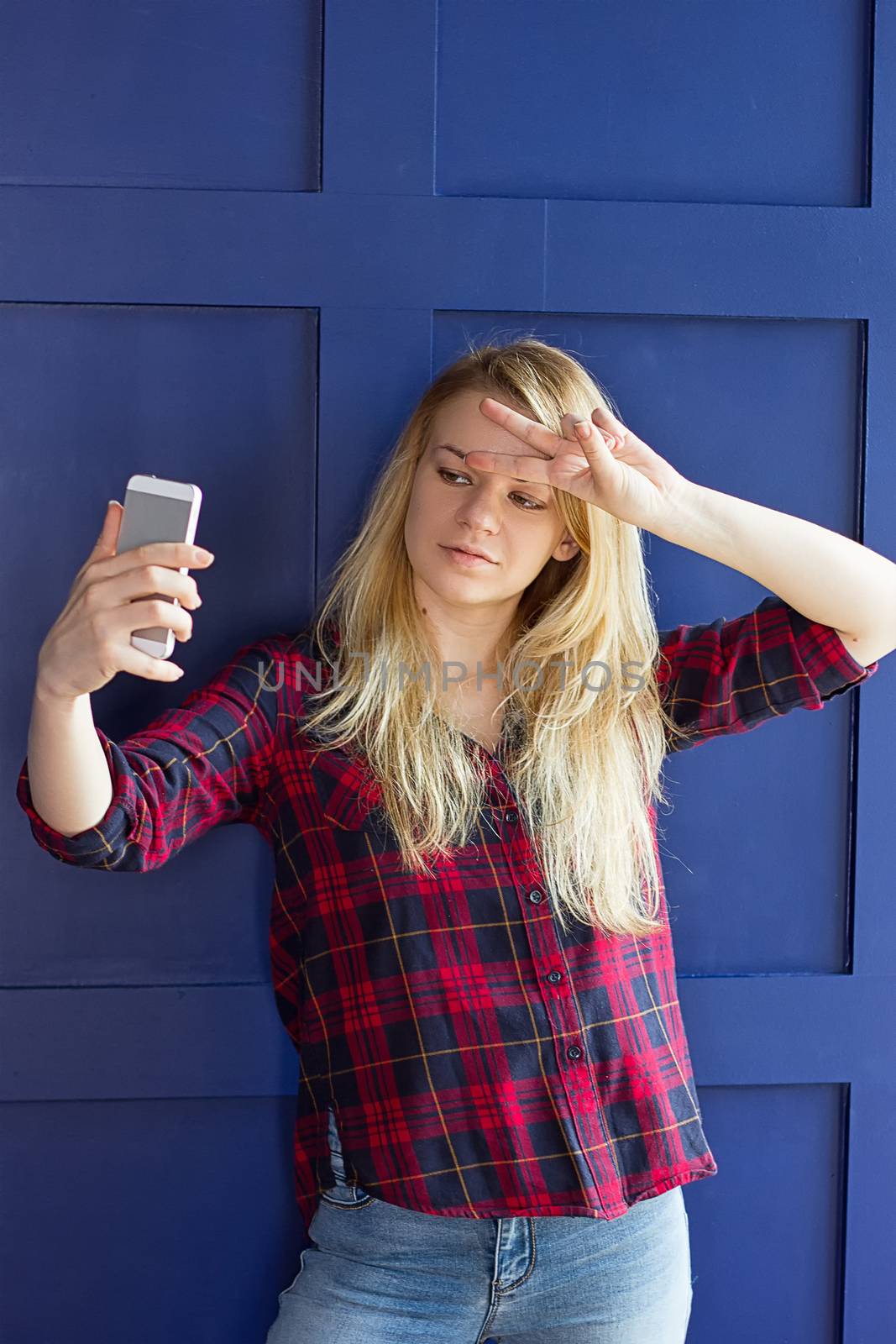 image of beautiful blond young lady making selfie by victosha