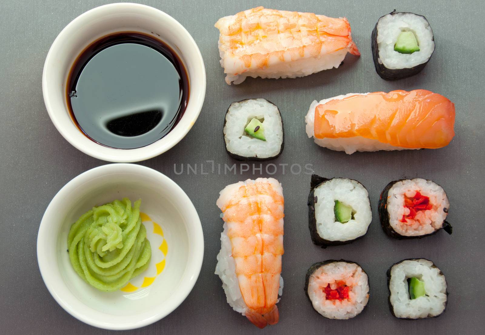 Closeup of sushi  snacks including prawns, salmon and vegetables with rice