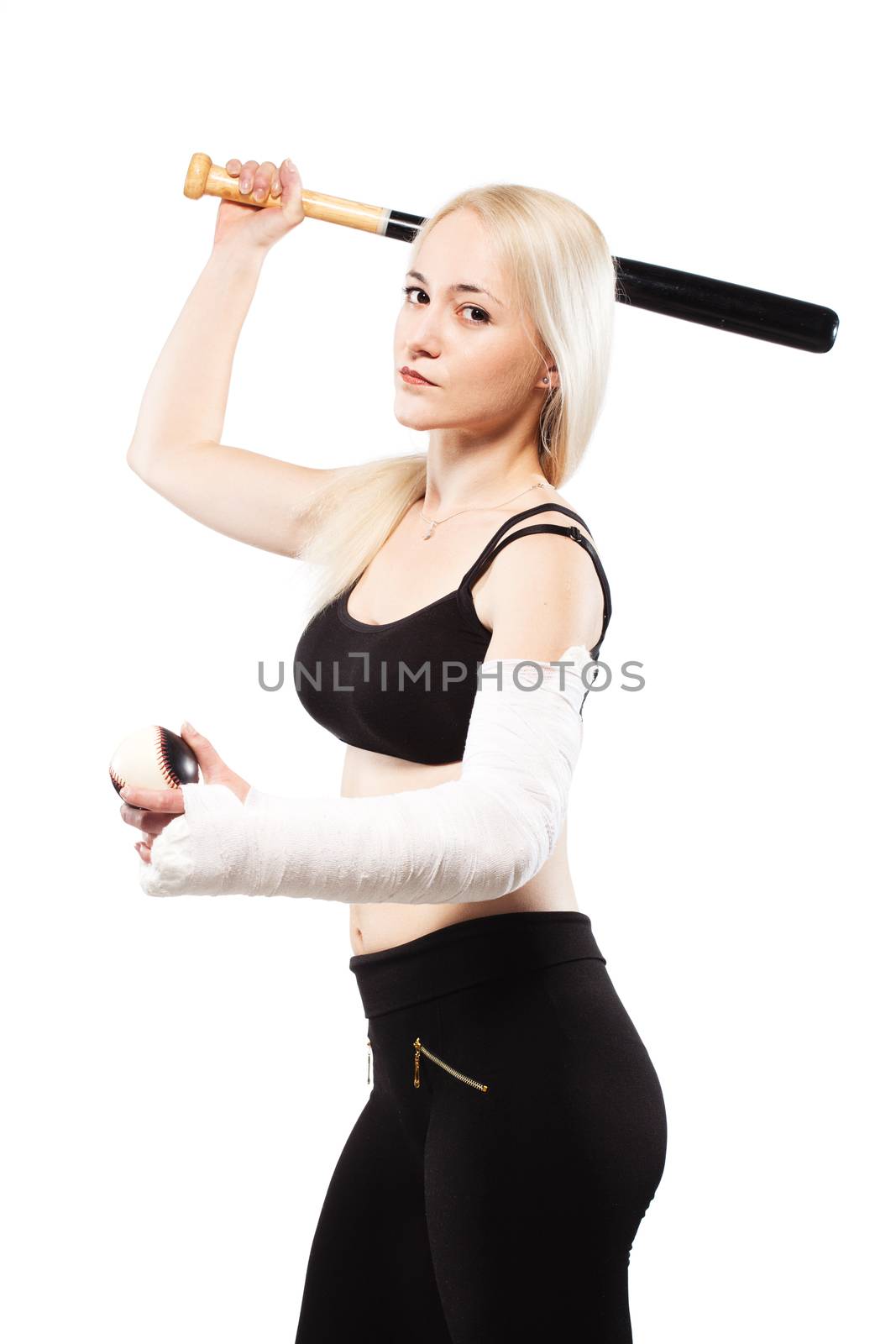 Blond girl with a broken arm in plaster, holding baseball bat and ball