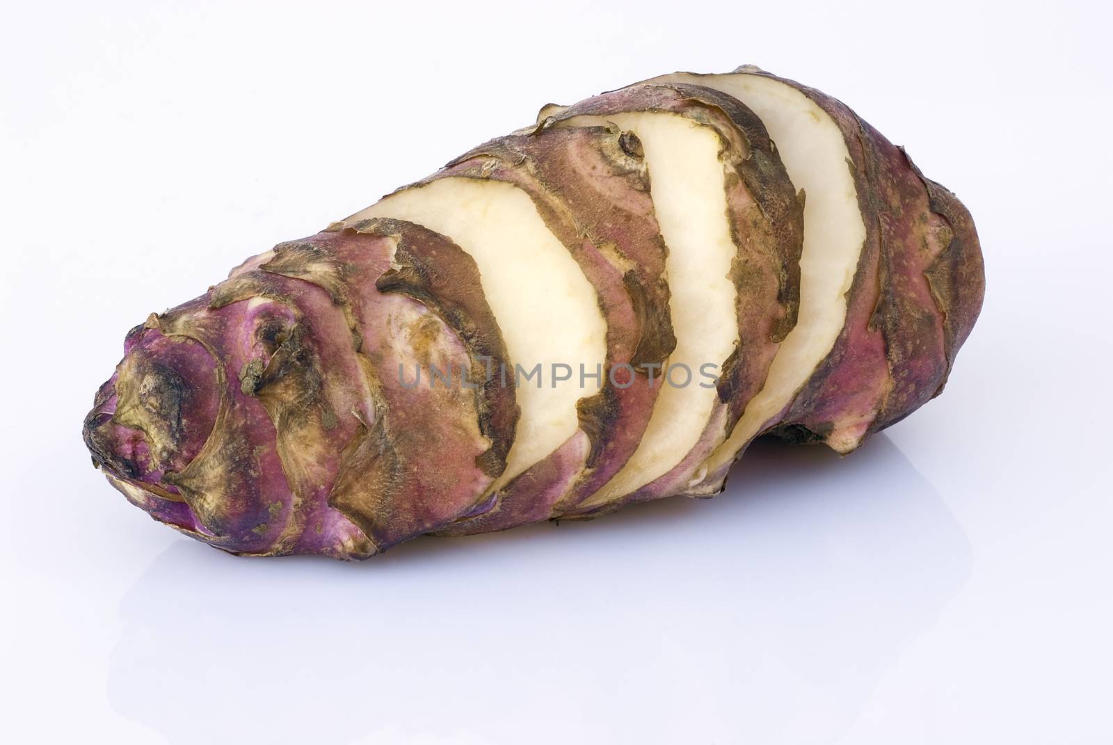 Topinambur root  isolated on white background. Also known as Jerusalem artichoke (Helianthus tuberosus). Edible rhizome native to North America with a taste similar to the artichoke.