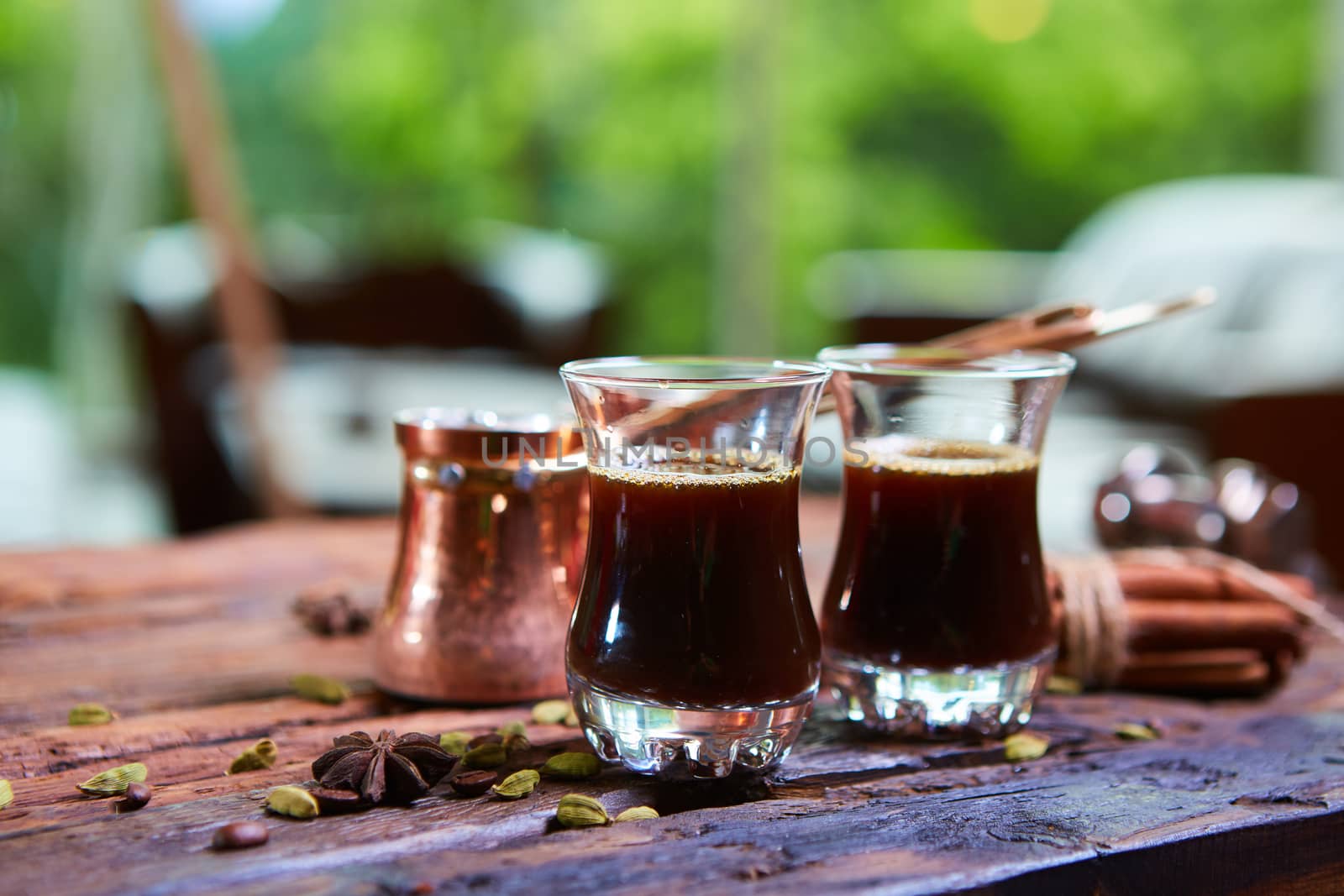 Traditional Arabic coffee. Traditional Arabic coffee. Two copper pots and two glass cups