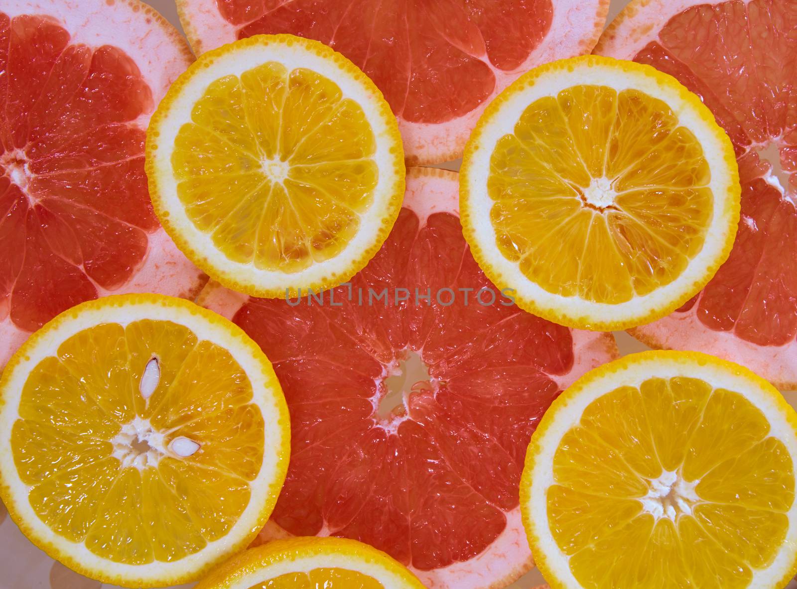 Orange and grapefruit rings background by sarymsakov