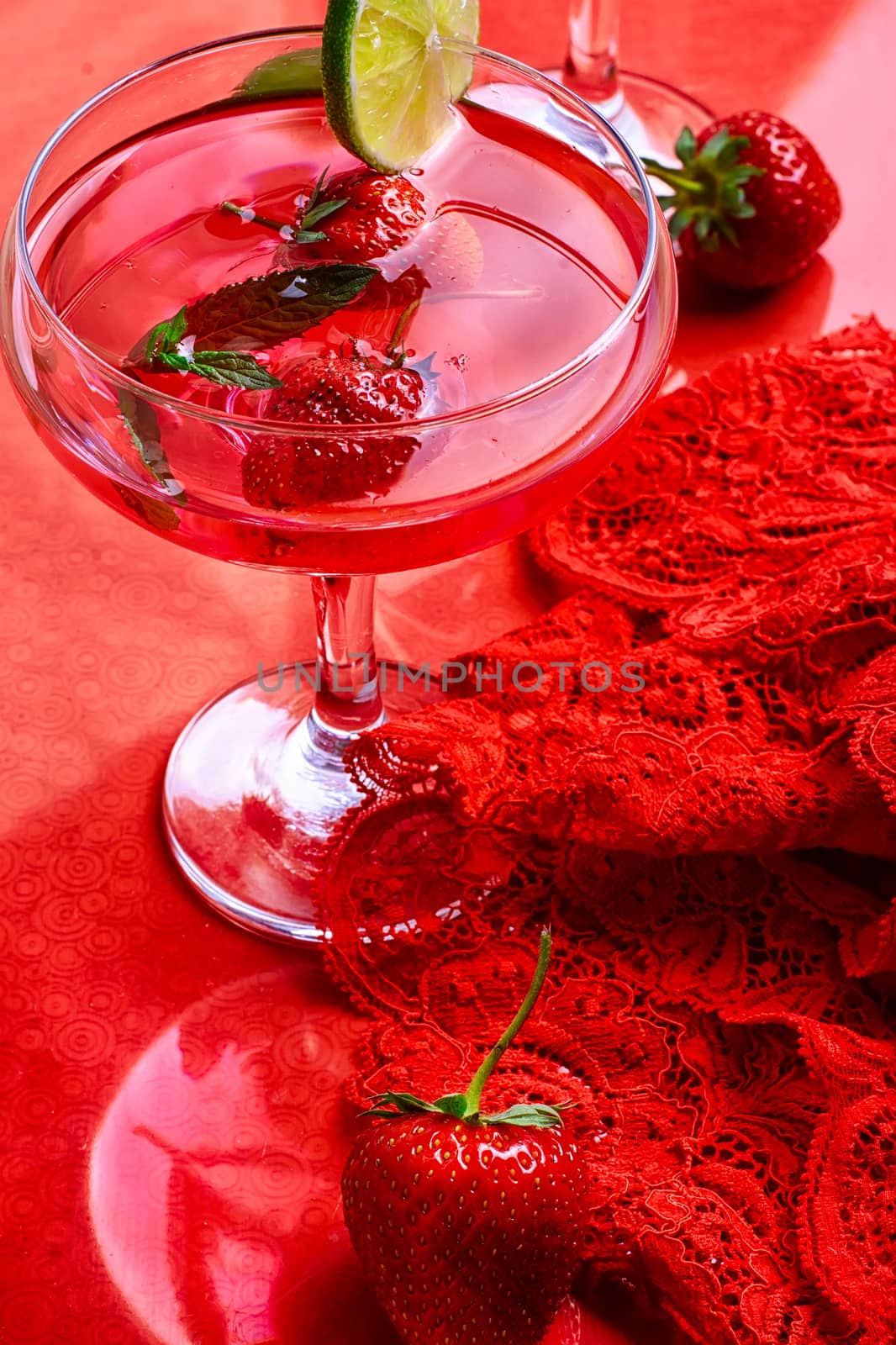 Martini glass with strawberries and red lace