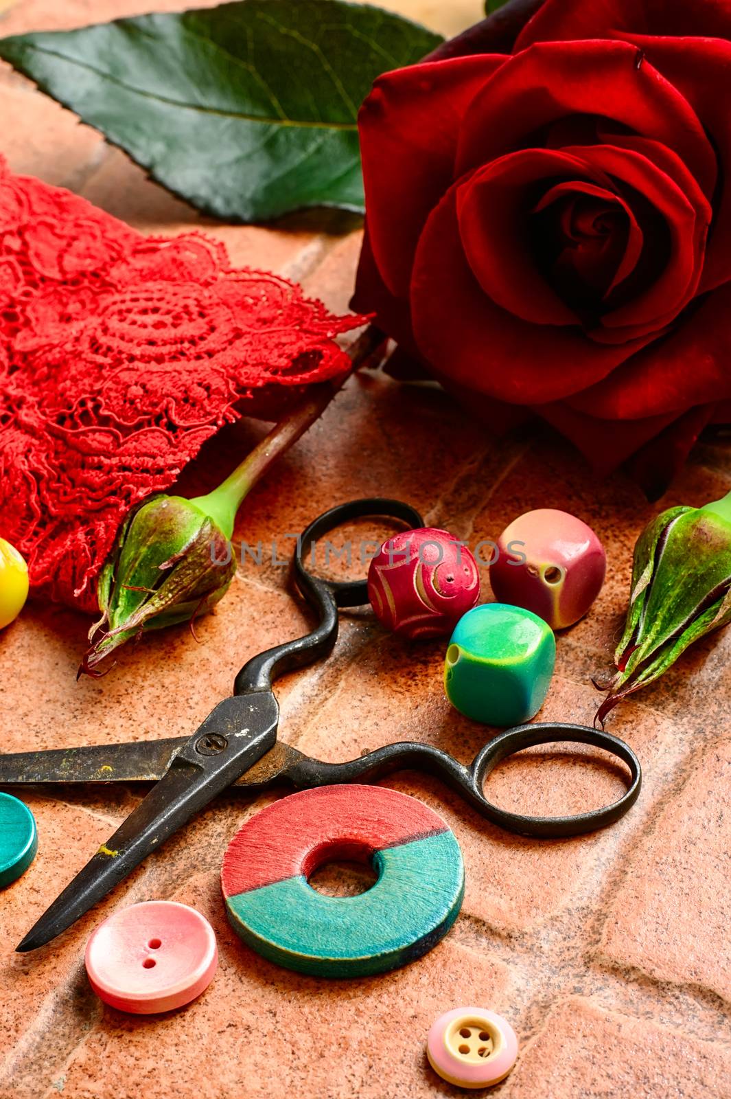Set for needlework from thread and beads on a stone background