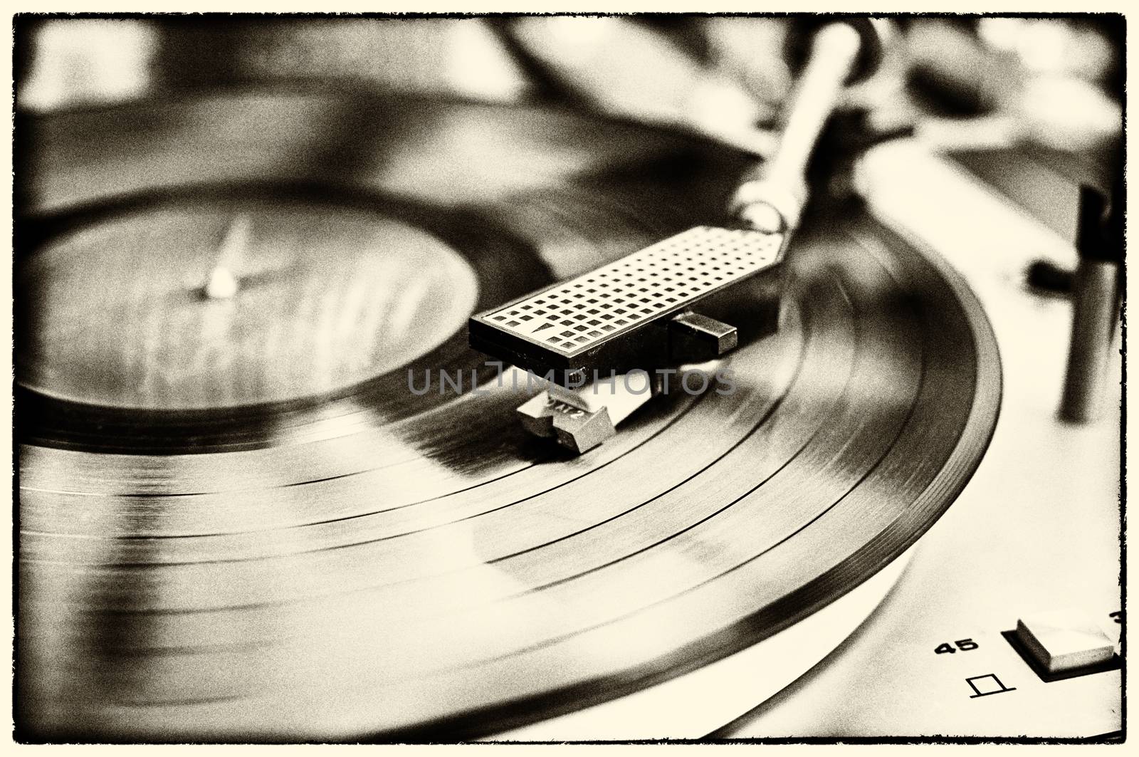 Textured retro image in black and white with border of vinyl record player.