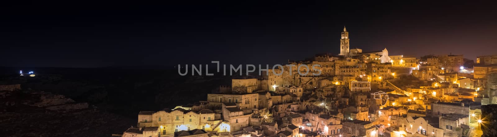 panoramic view of typical stones (Sassi di Matera) and church of Matera UNESCO European Capital of Culture 2019  at night 