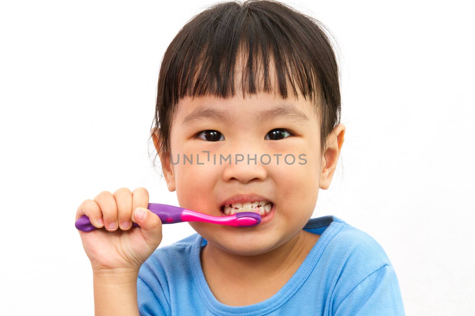 Chinese little girl brushing teeth by kiankhoon