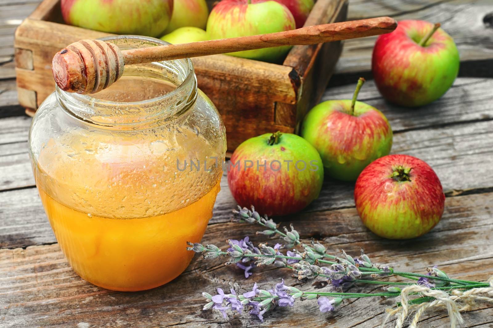 Fragrant summer apples and jar of honey