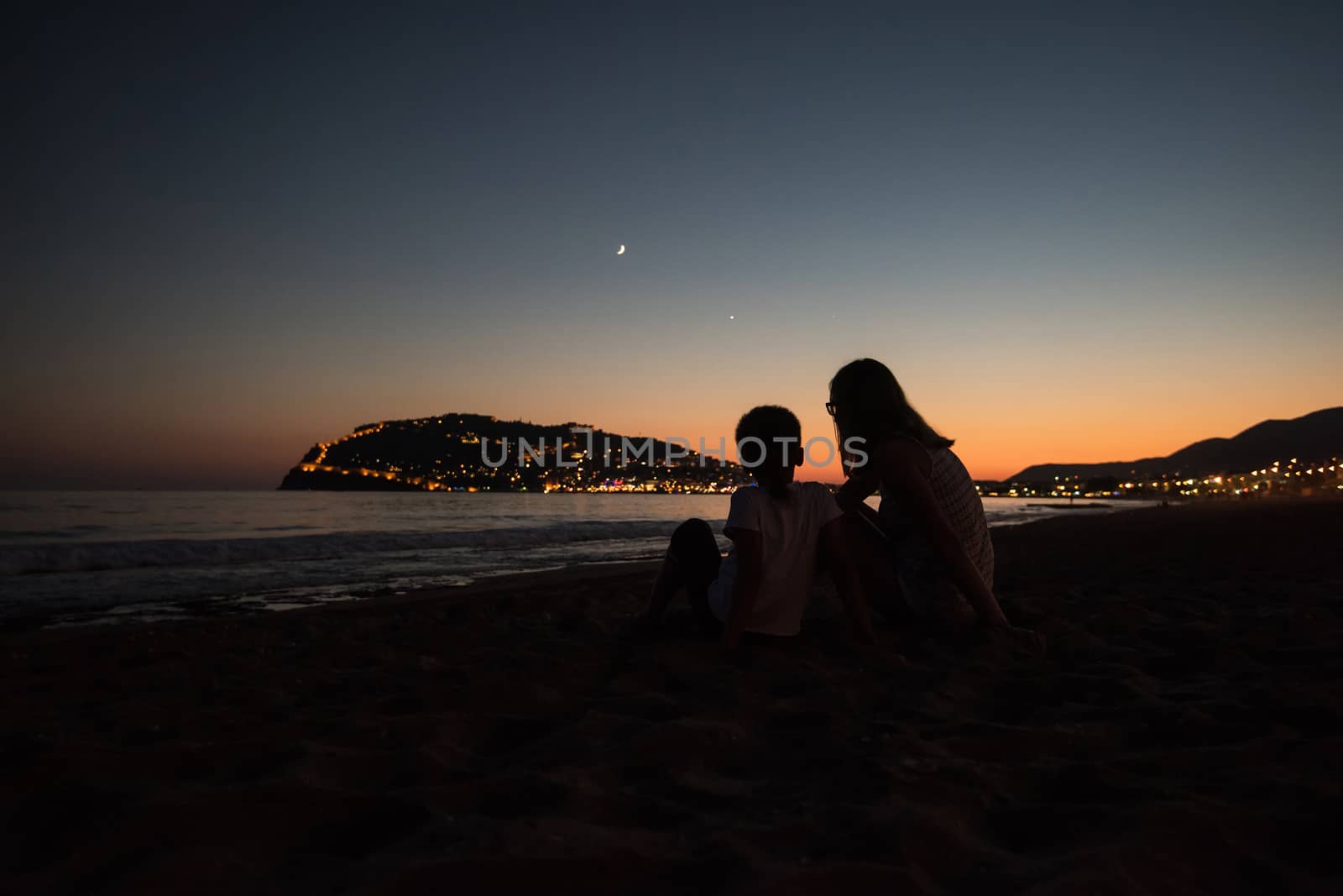 Mother and son at Alanya beach, view from the beach, one of the famous destinations in Turkey.